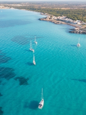 Aerial,View,Of,Boats,Sailing,At,Sunrise,In,Majorca,Blue